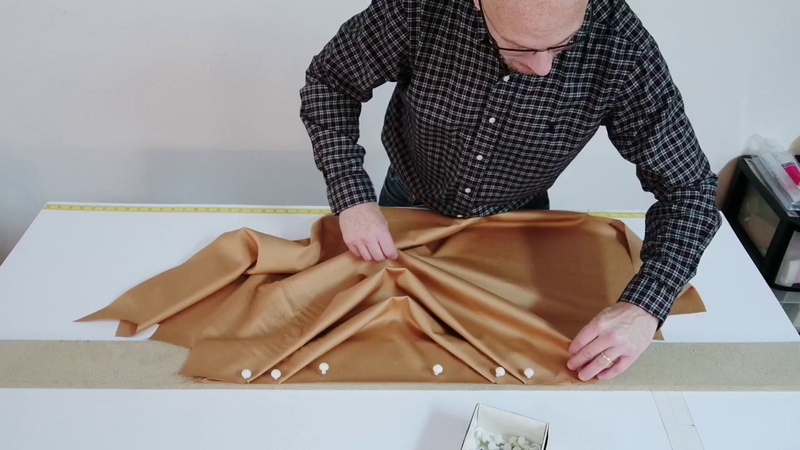 Close up view of professionally pleating a swag